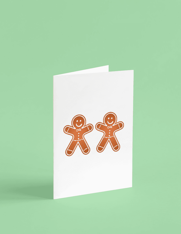 two gingerbread men printed on white cardstock. Card is blank inside